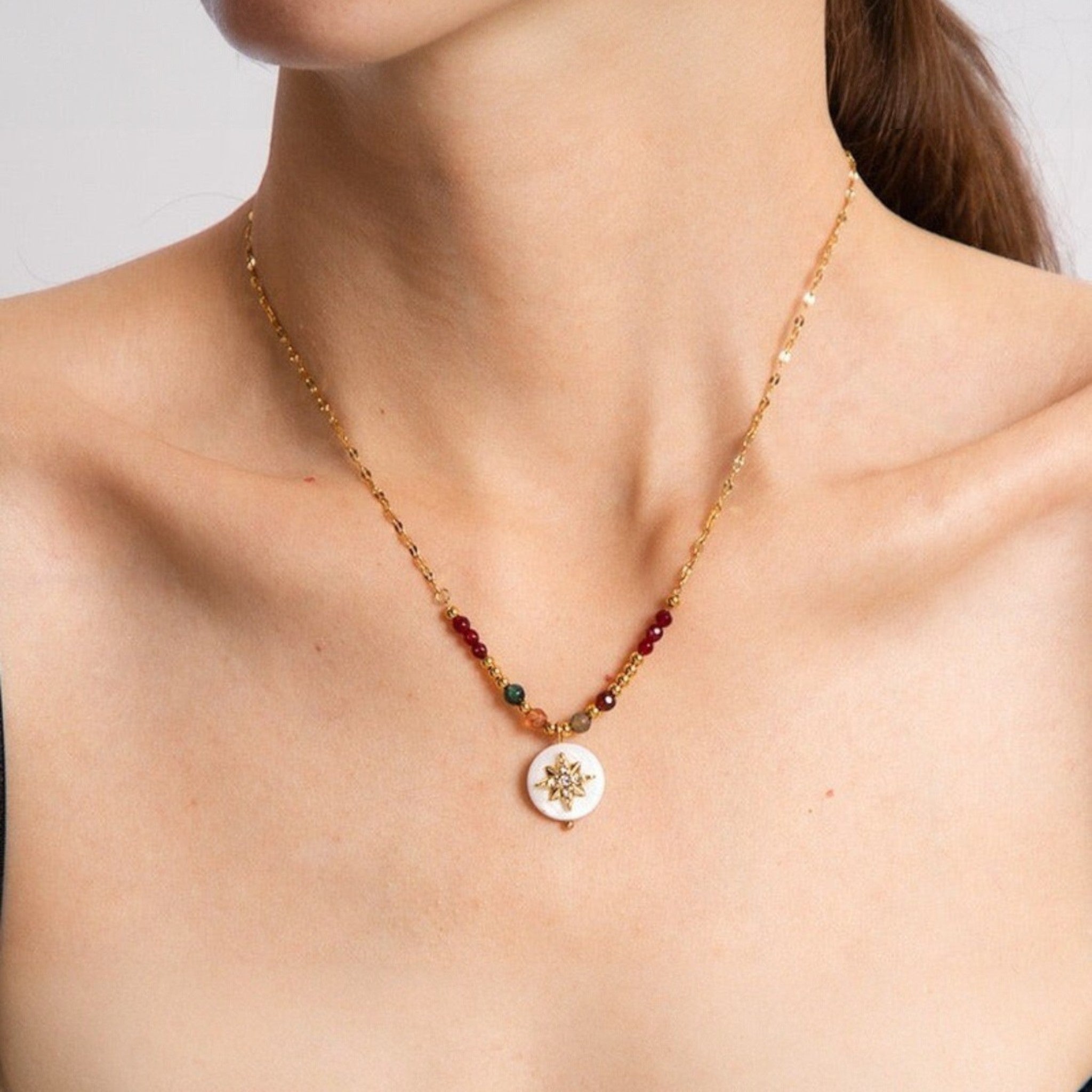 Tania Claire Australia gold-plated sterling silver necklace with white compass charm and colourful gemstone accents.