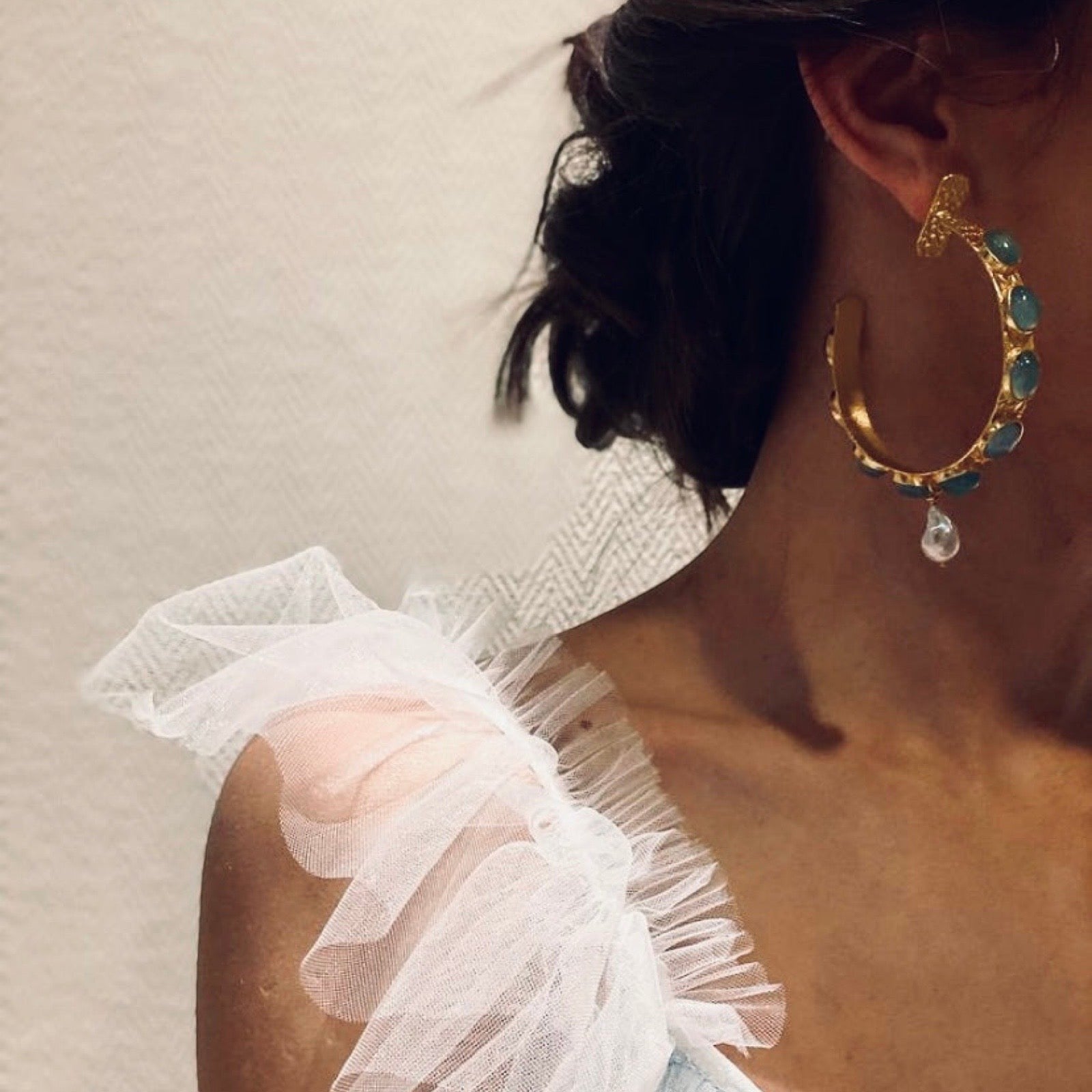 Tania Claire Australia Frida Hoop Earrings with gold-plated brass, baroque pearls, and blue gemstones.