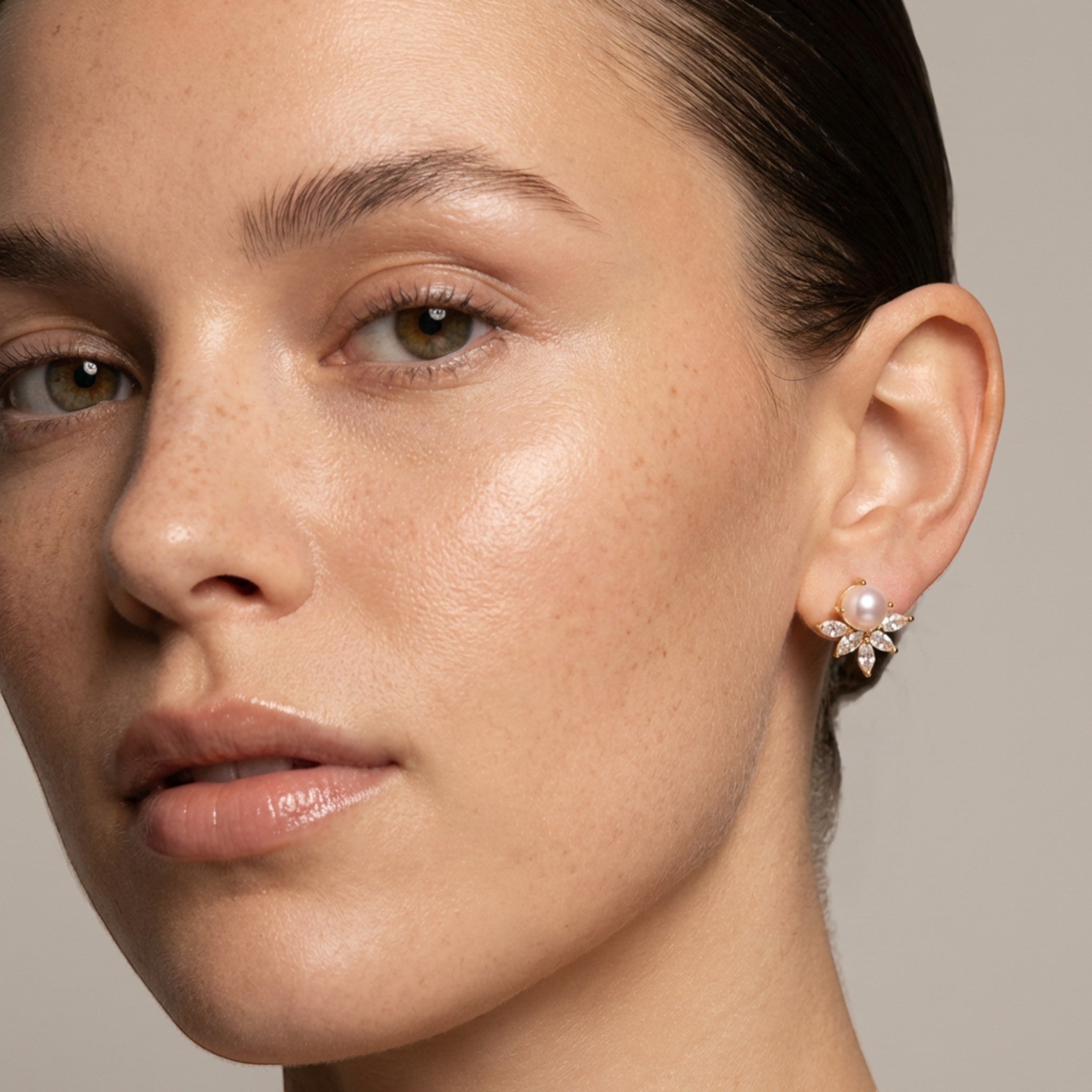 Tania Claire Australia gold-tone drop earrings with pearl and cubic zirconia in a floral design.