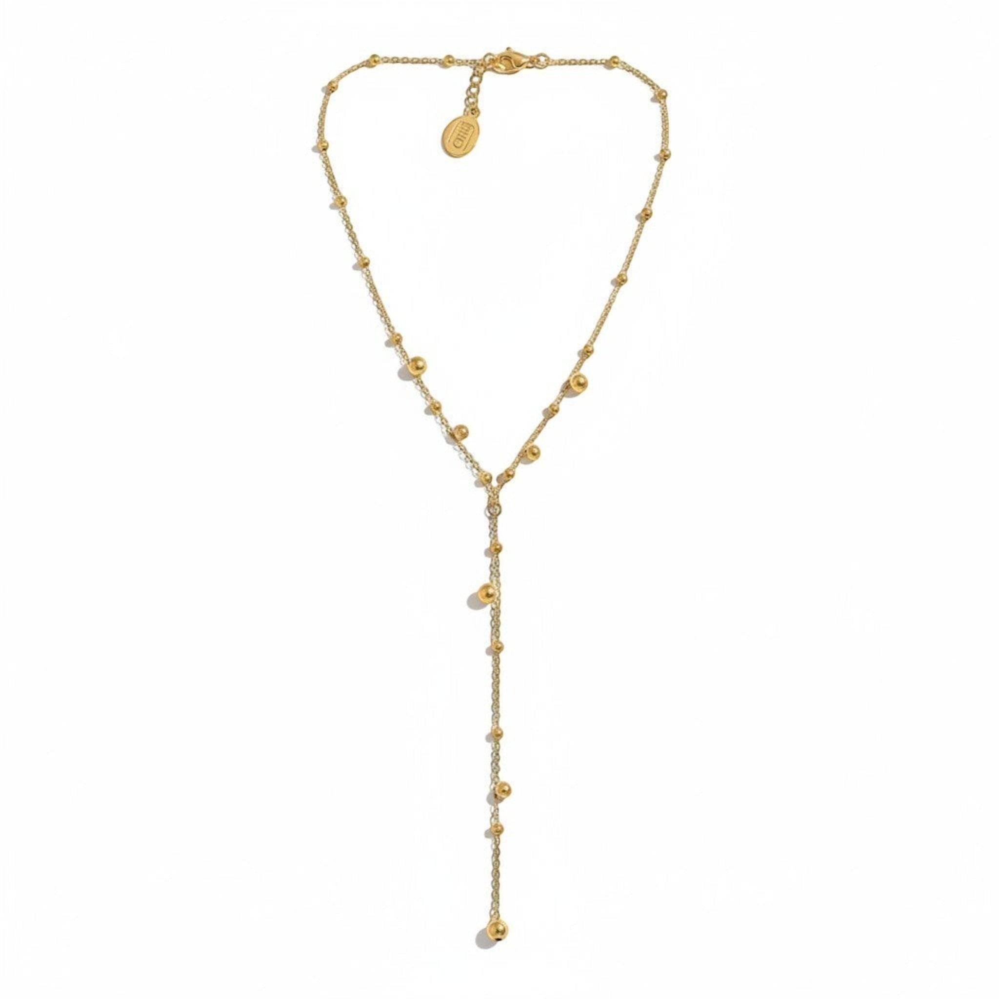 Tania Claire Australia gold bubble necklace with a Y-drop chain and small bead accents.