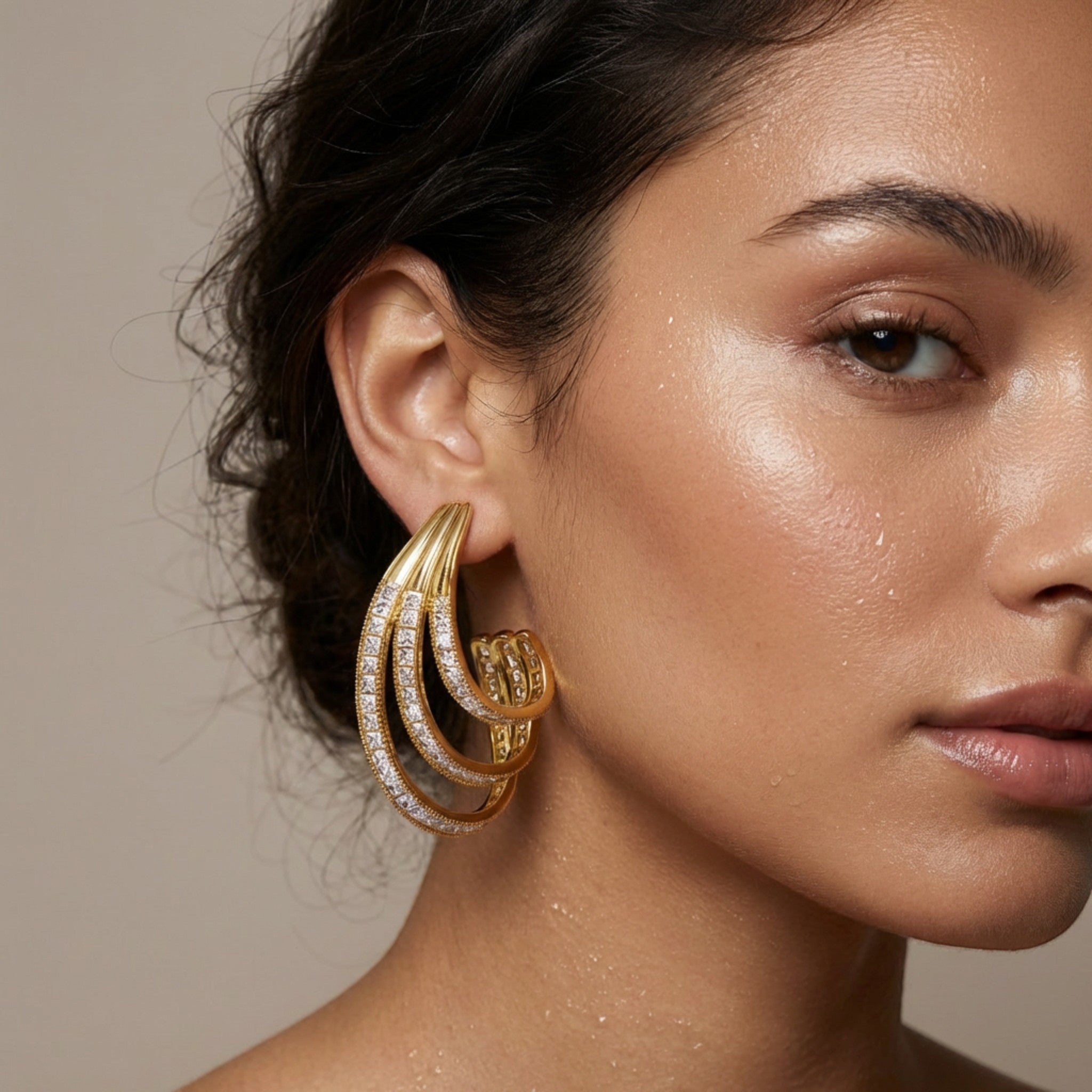 Tania Claire Australia Aurelia Arc gold-tone sculptural statement earrings with crystal pavé accents.