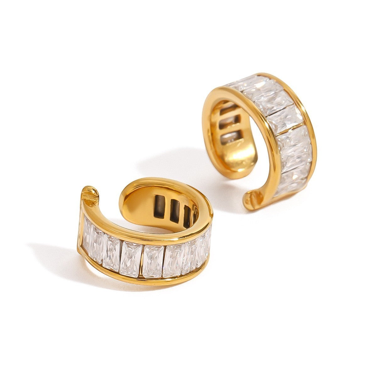 Tania Claire Australia gold-tone ear cuffs with baguette-cut clear crystals. Designed as a set of three.