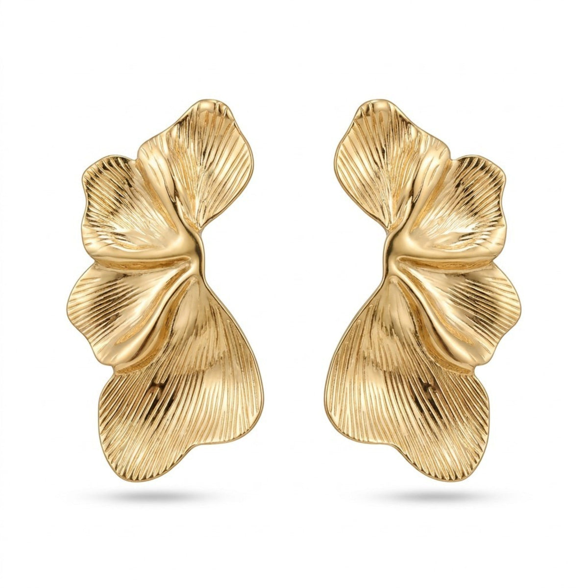 Tania Claire Australia Dryas Crest earrings featuring sculptural gold leaf designs with ribbed textures.