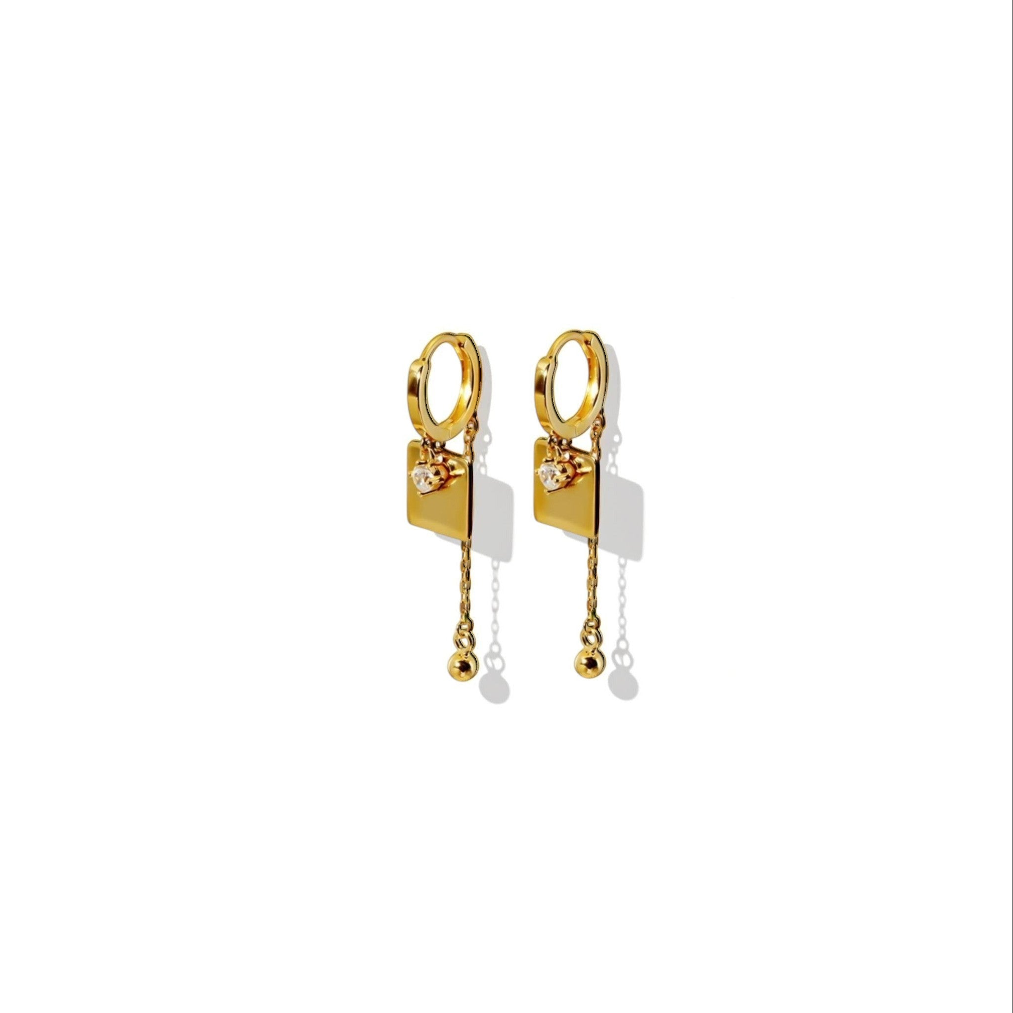 Tania Claire Australia gold-plated hoop earrings with square charm, cubic zirconia, and dangling chain with bead.