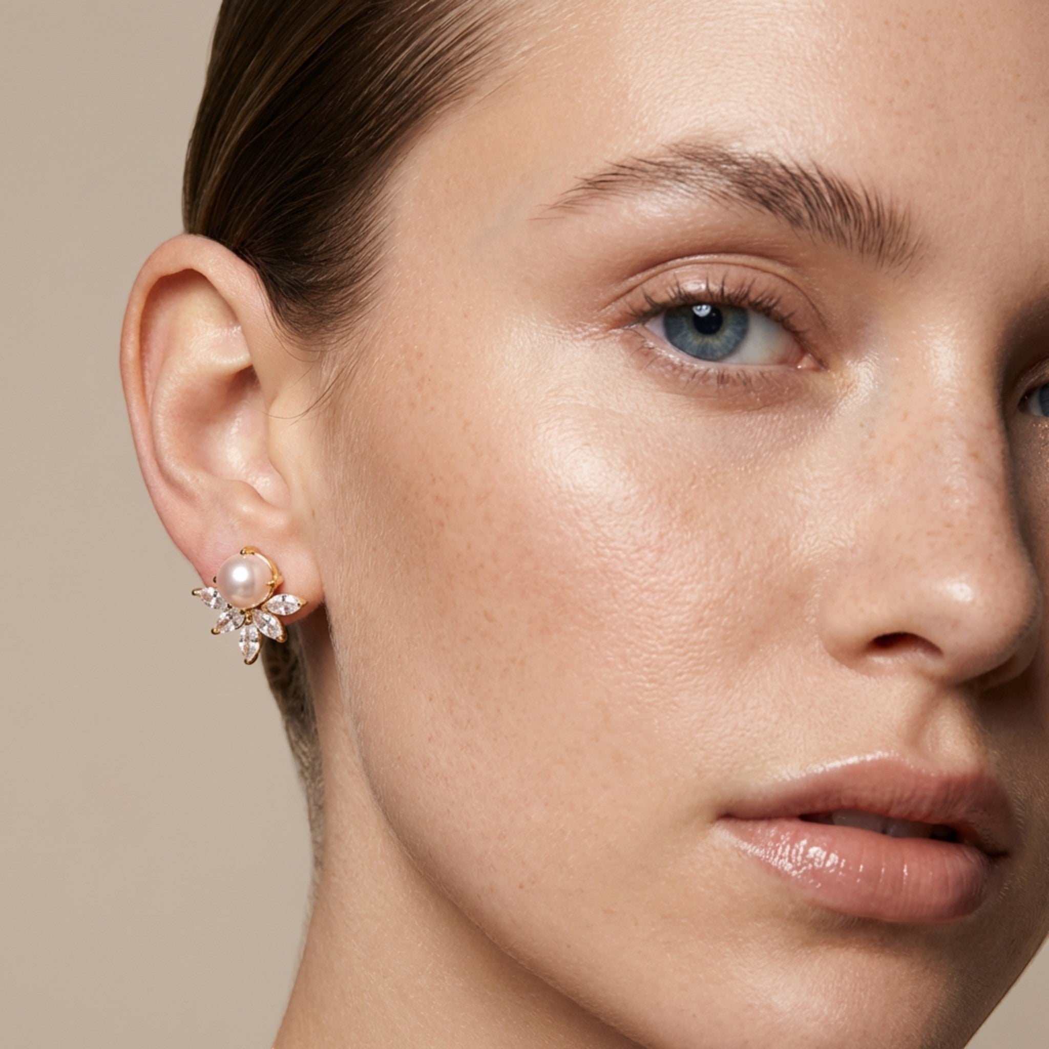 Tania Claire Australia gold-tone drop earrings with pearl and cubic zirconia in a floral design.