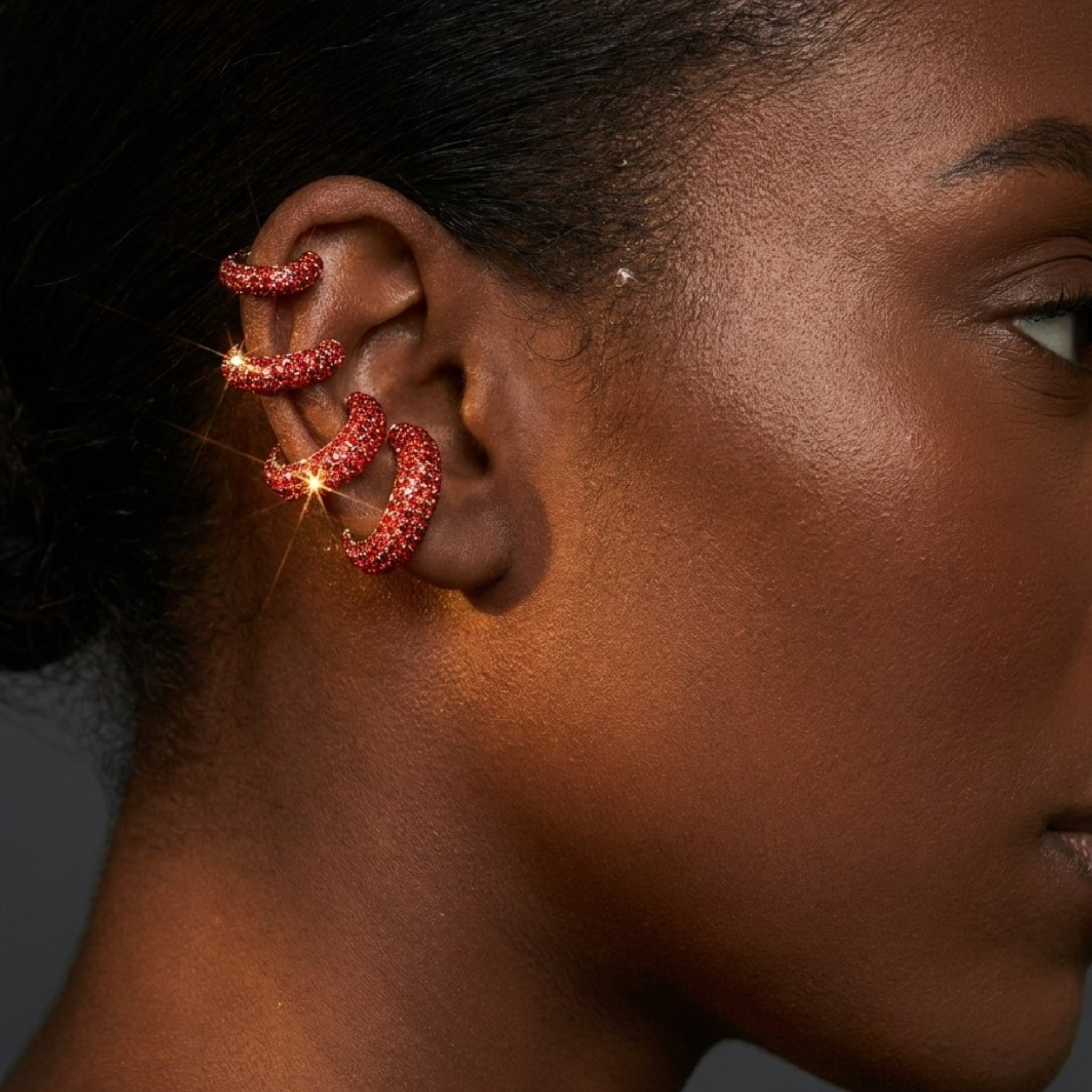 Tania Claire Australia Selene triple-wrap red crystal pavé ear cuff worn on a model&