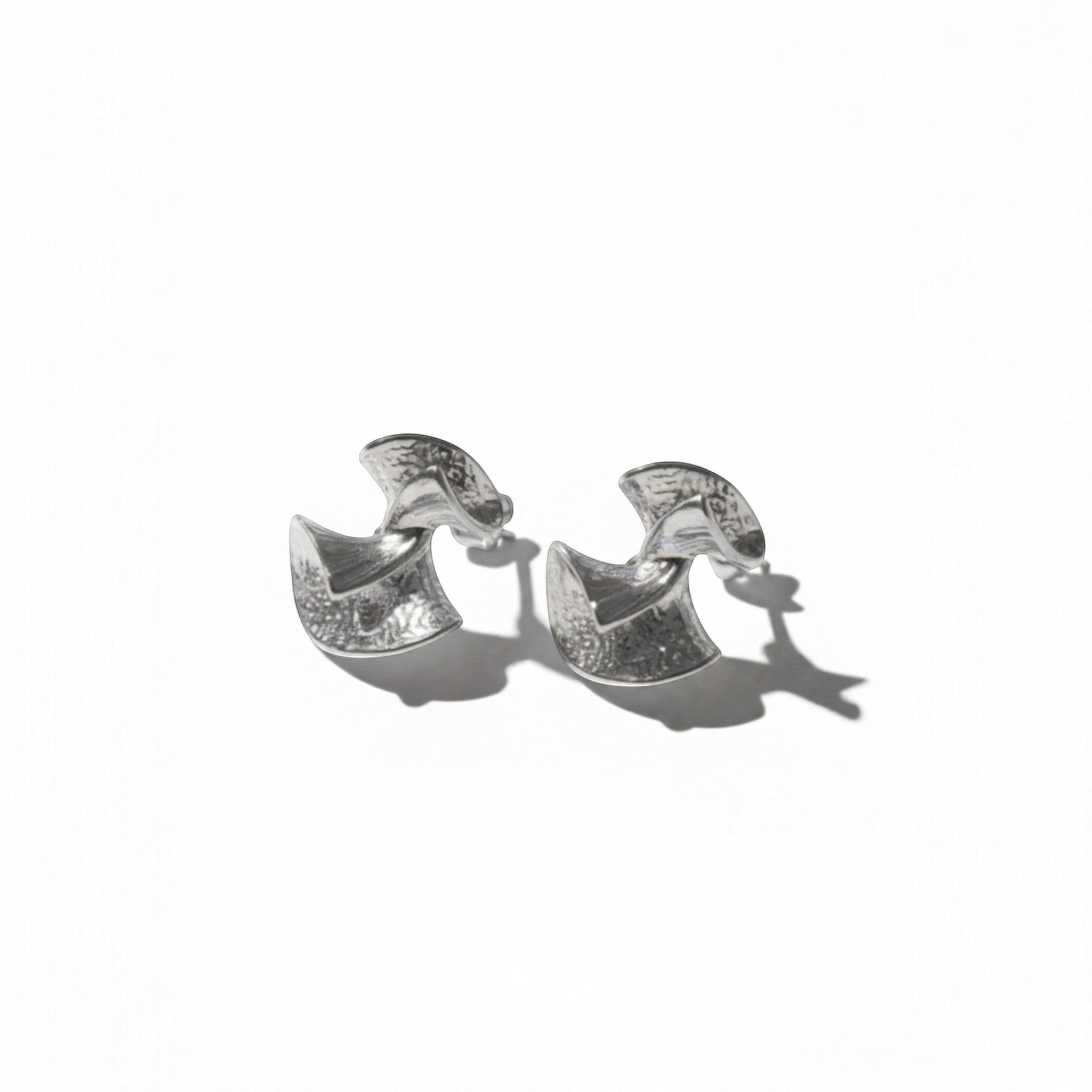 Tania Claire Australia silver abstract bell drop earrings with textured finish and sculptural design.