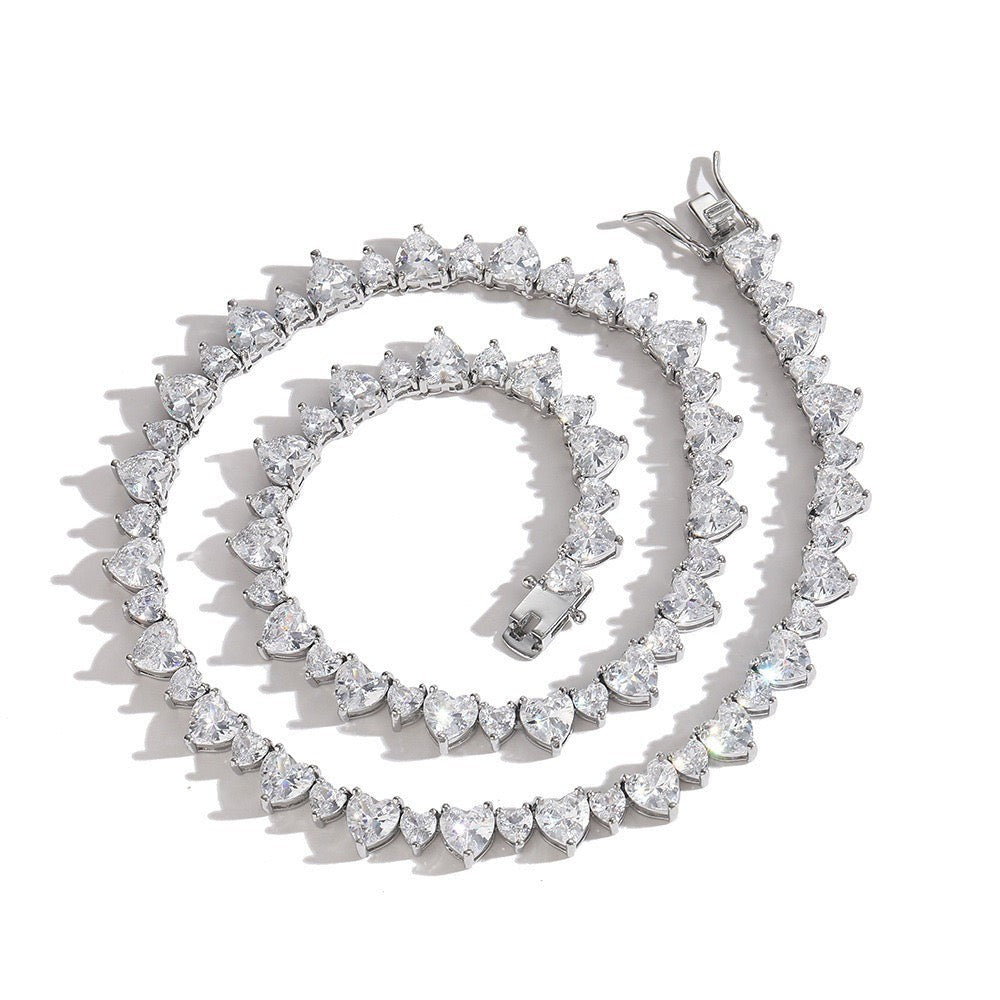 Tania Claire Australia Venus Necklace with heart-shaped cubic zirconia stones and 18K gold-plated brass.