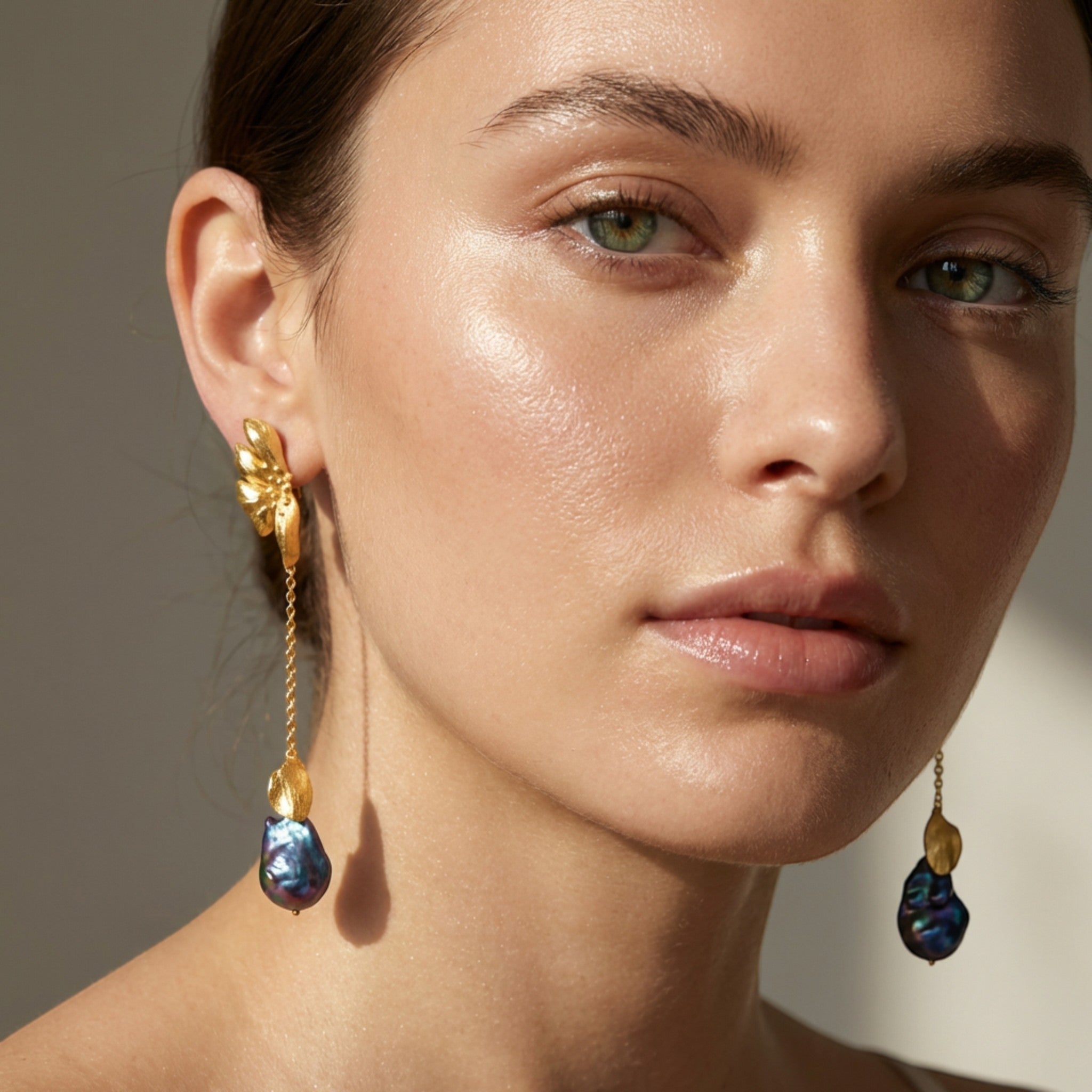 Tania Claire Australia Iridesca baroque pearl drop earrings in gold with iridescent violet, blue, and green pearl.