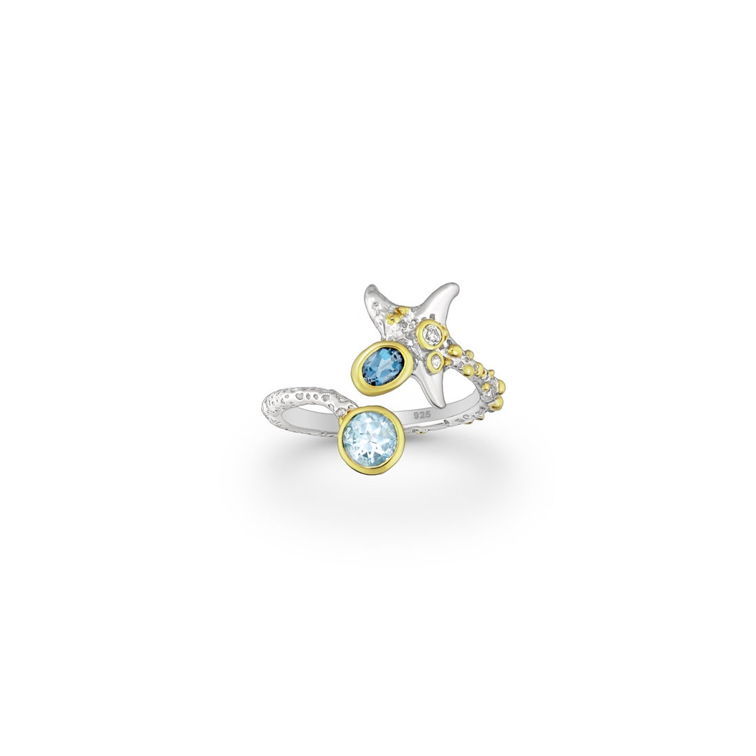 A sterling silver ring with 22k yellow gold plating, featuring a design inspired by manta rays and decorated with blue topaz stones.