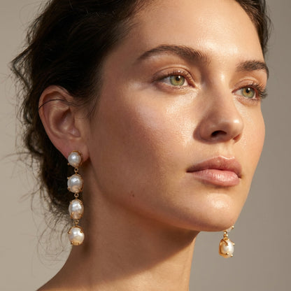 Tania Claire Australia Marnie baroque pearl drop earrings with gold-tone bezel, cascading pearls.