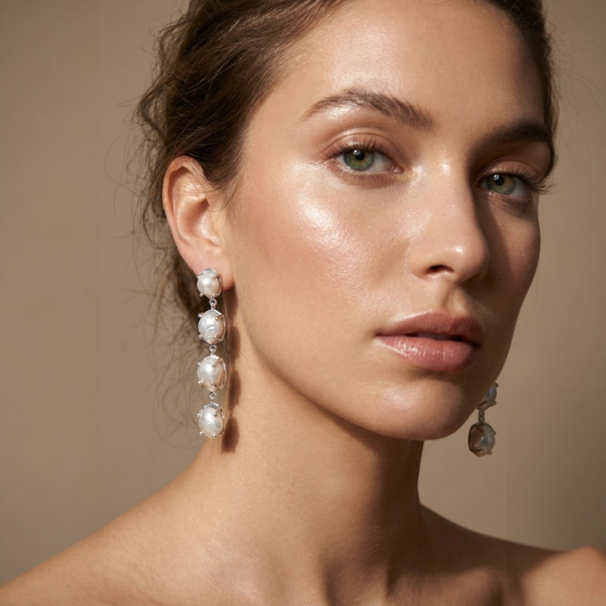 Tania Claire Australia Marnie baroque pearl drop earrings with silver-tone bezels, cascading elegantly.