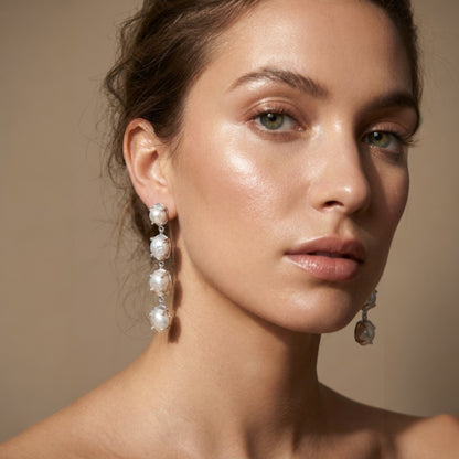 Tania Claire Australia Marnie baroque pearl drop earrings with silver-tone bezels, cascading elegantly.