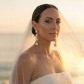 Tania Claire Australia gold-plated brass drop earrings with three baroque freshwater pearls.