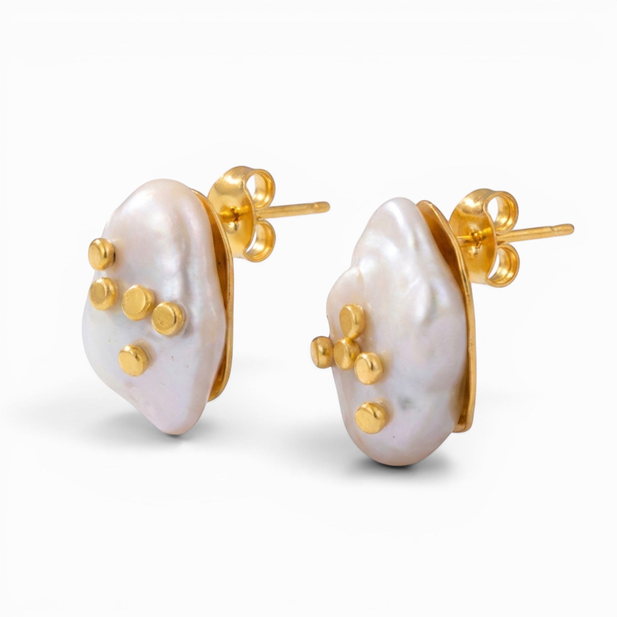 Tania Claire Australia Tide Mark earrings featuring asymmetrical baroque pearls with gold accents, 14K gold plated brass.