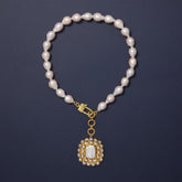 Tania Claire Australia Palais Lumière necklace with baroque freshwater pearls and gold-plated pendant.
