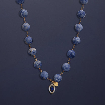 Tania Claire Australia Bleu Royale necklace with marbled sodalite beads and a sapphire pendant framed with crystals.