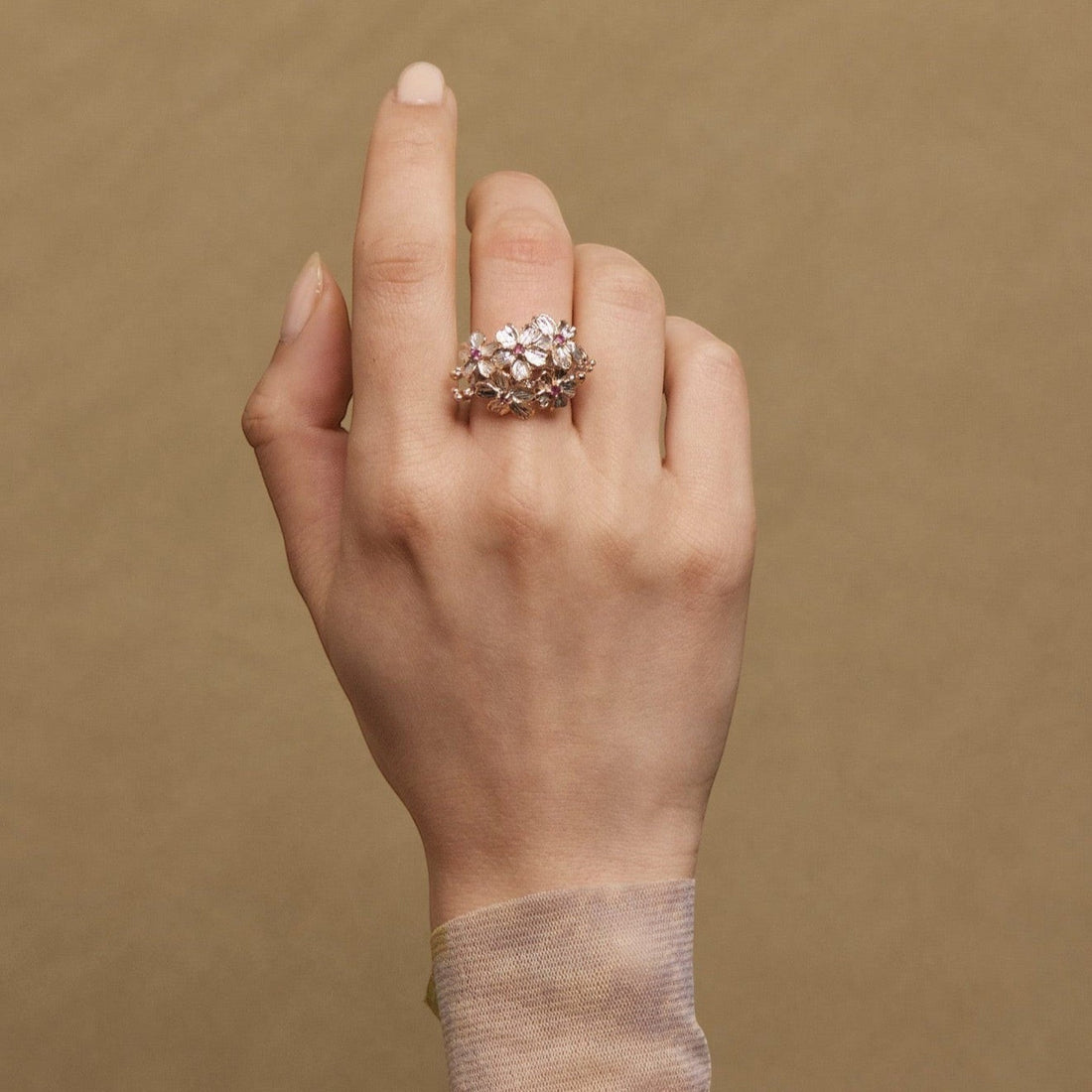 Tania Claire Australia Blossom Ring: Sterling silver floral ring with rose gold plating, pink sapphires, and silver accents.