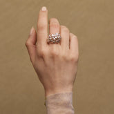 Tania Claire Australia Blossom Ring: Sterling silver floral ring with rose gold plating, pink sapphires, and silver accents.