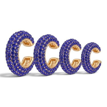 Tania Claire Australia Selene ear cuff stack featuring four gold-tone hoops encrusted with vibrant blue pavé crystals.