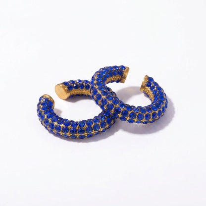 Tania Claire Australia Fluer Cuffs featuring vibrant blue rhinestones on a gold-tone base, non-pierced ear design.