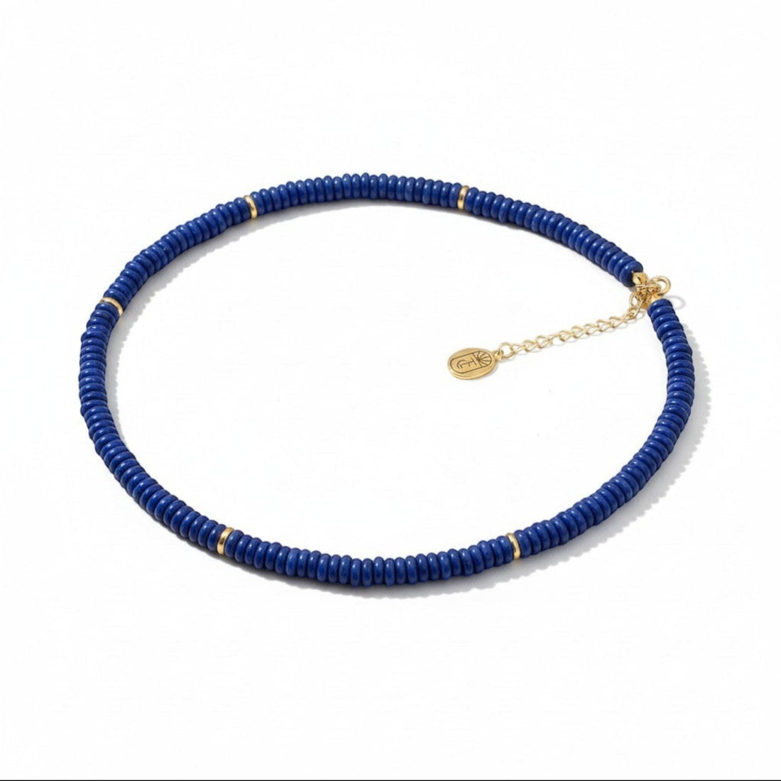 Tania Claire Australia Celestial Night Necklace: deep blue lapis lazuli beads with gold accents, adjustable gold chain.