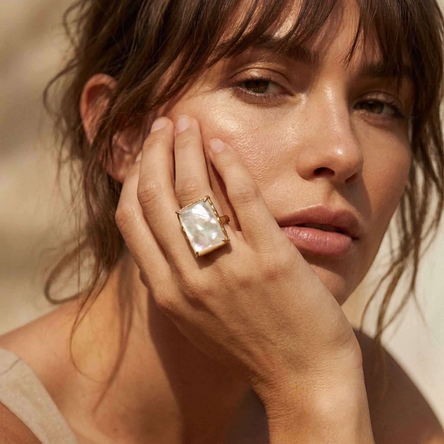 Tania Claire Australia Cleo Gemstone Ring with a rectangular mother-of-pearl stone in a gold-tone setting.
