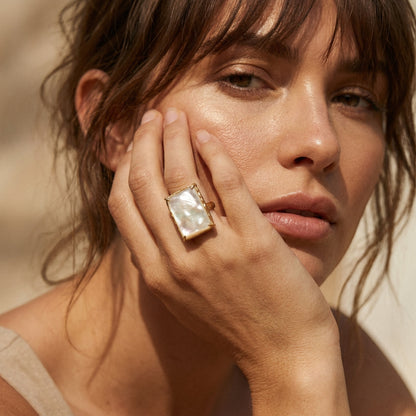 Tania Claire Australia Cleo Gemstone Ring with a rectangular mother-of-pearl stone in a gold-tone setting.