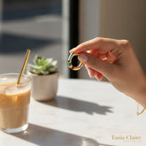 Tania Claire Australia gold-plated hoop earring with colorful enamel stripes in green, burgundy, yellow, and pink.