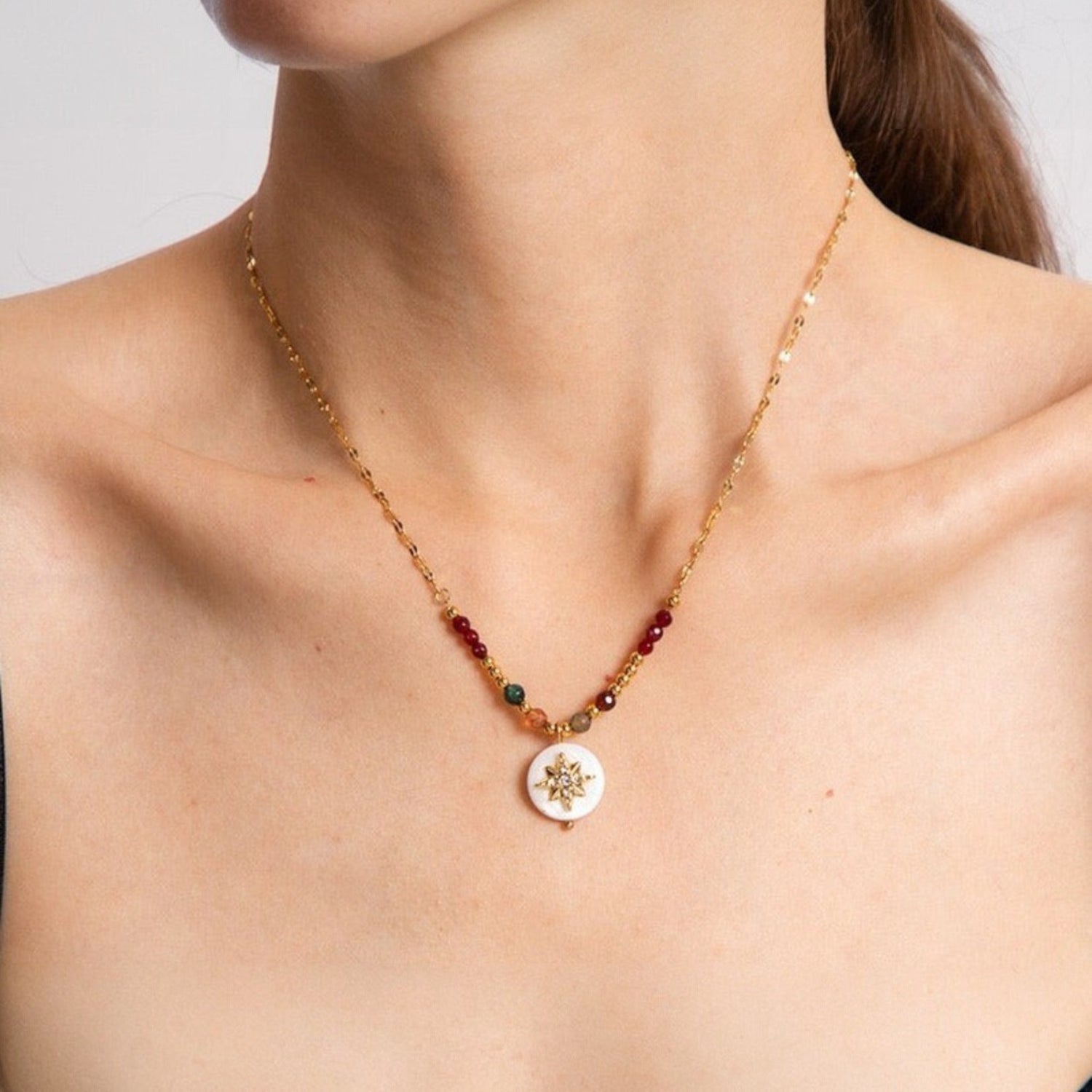 Tania Claire Australia gold-plated sterling silver necklace with white compass charm and colourful gemstone accents.