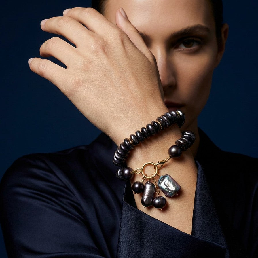 Tania Claire Australia Étoile Noir Bracelet: dark iridescent freshwater pearls with baroque pearl charms and gold clasp.