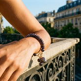 Tania Claire Australia Étoile Noir Bracelet with iridescent midnight freshwater pearls and baroque pearl charms on a gold clasp.