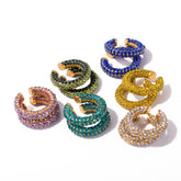 Tania Claire Australia Fluer Cuffs featuring multiple vibrant rhinestone ear cuffs in various colors on white background