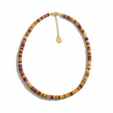 Tania Claire Australia multi-gemstone beaded necklace with gold extender chain. Features earthy tones of red, yellow, pink, and brown.