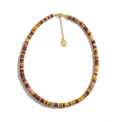 Tania Claire Australia multi-gemstone beaded necklace with gold extender chain. Features earthy tones of red, yellow, pink, and brown.