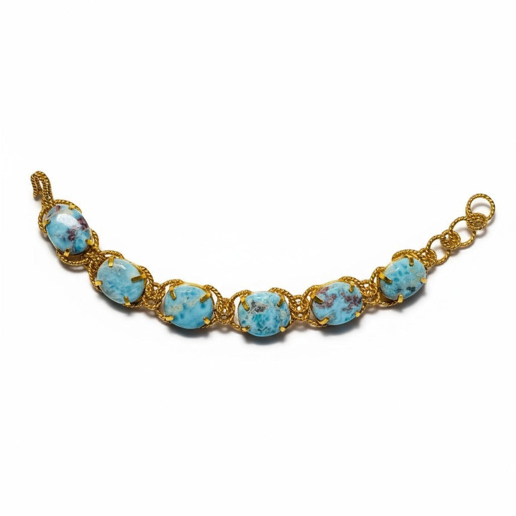 Tania Claire Australia Holly Gemstone Twist Bracelet with cabochon cut blue gemstones and gold plating.