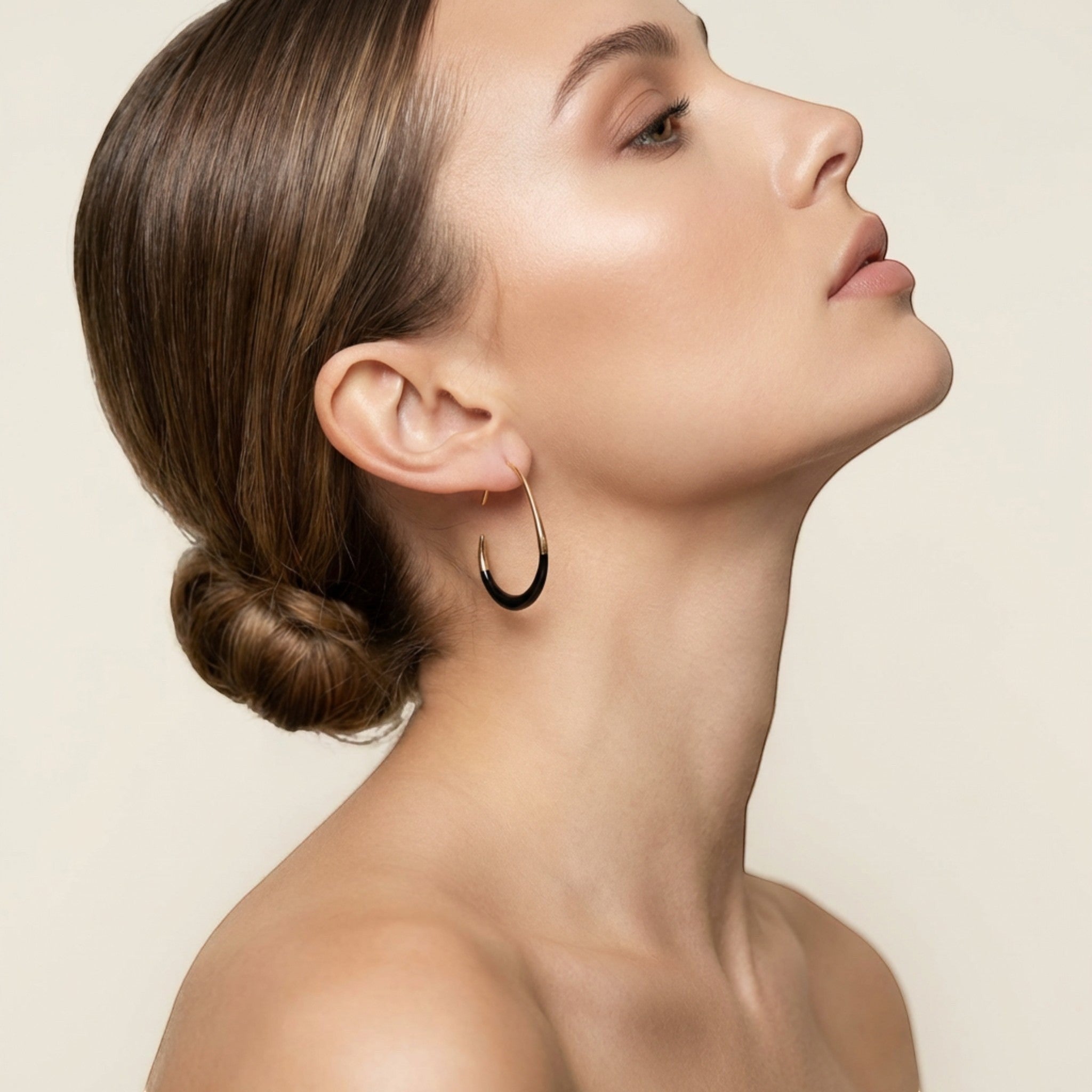 Tania Claire Australia Terra Drop earrings: gold-toned hoops with black enamel inlay, 40mm long.