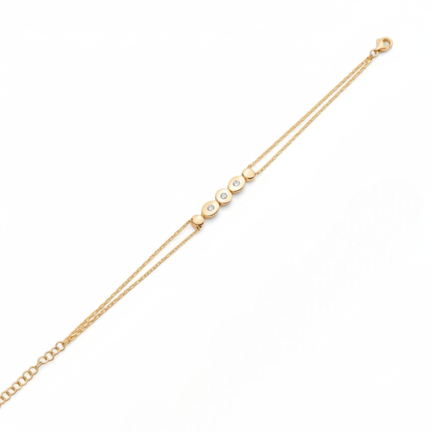 Tania Claire Australia gold double chain bracelet with five circular charms, three set with sparkling stones.