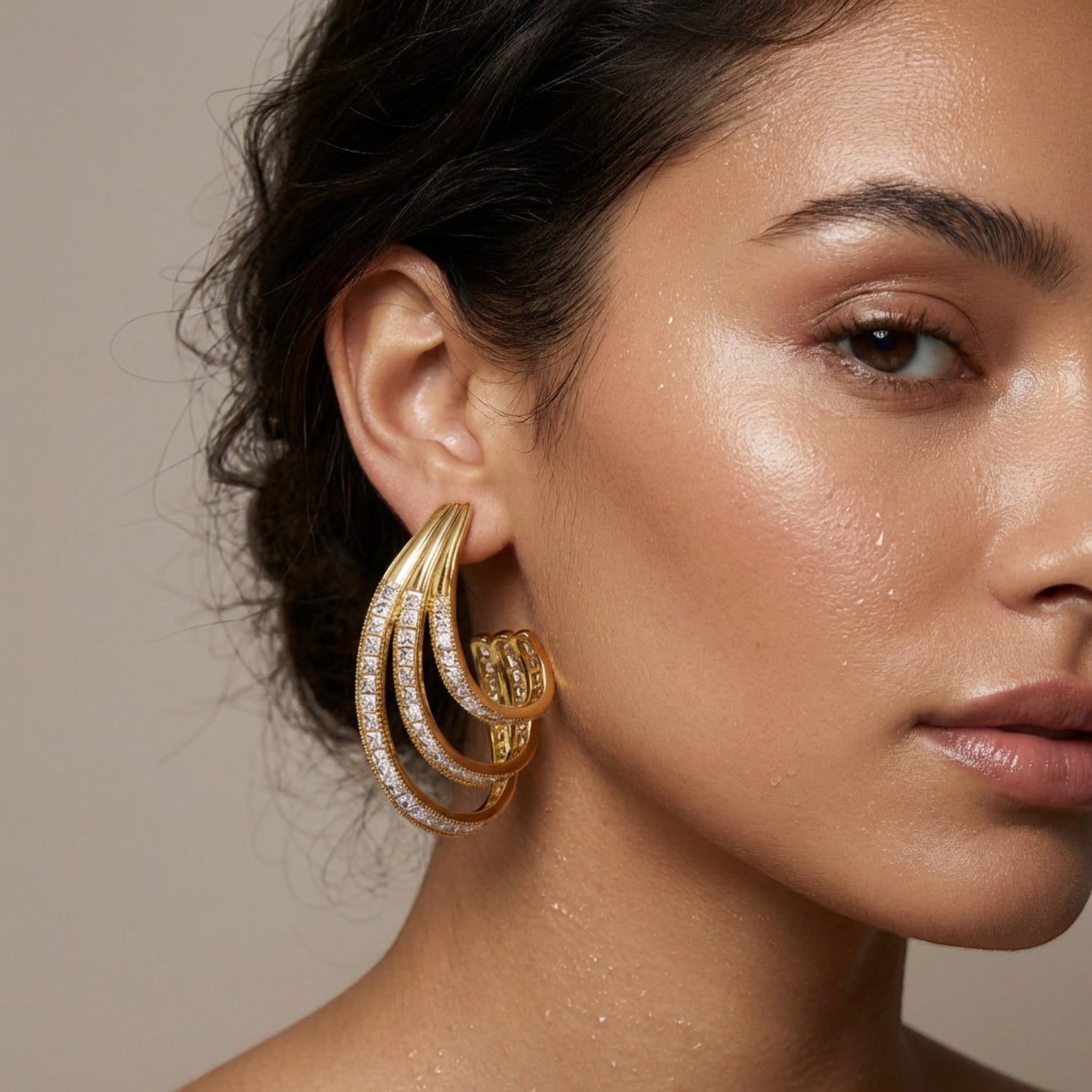 Tania Claire Australia Aurelia Arc gold-tone sculptural statement earrings with crystal pavé accents.