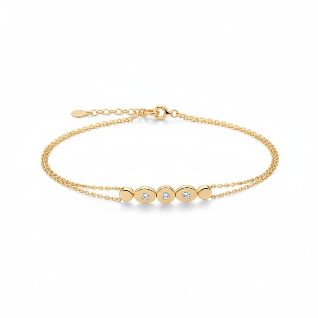 Tania Claire Australia gold bracelet with double chain and three sparkling stones set in oval gold bezels.