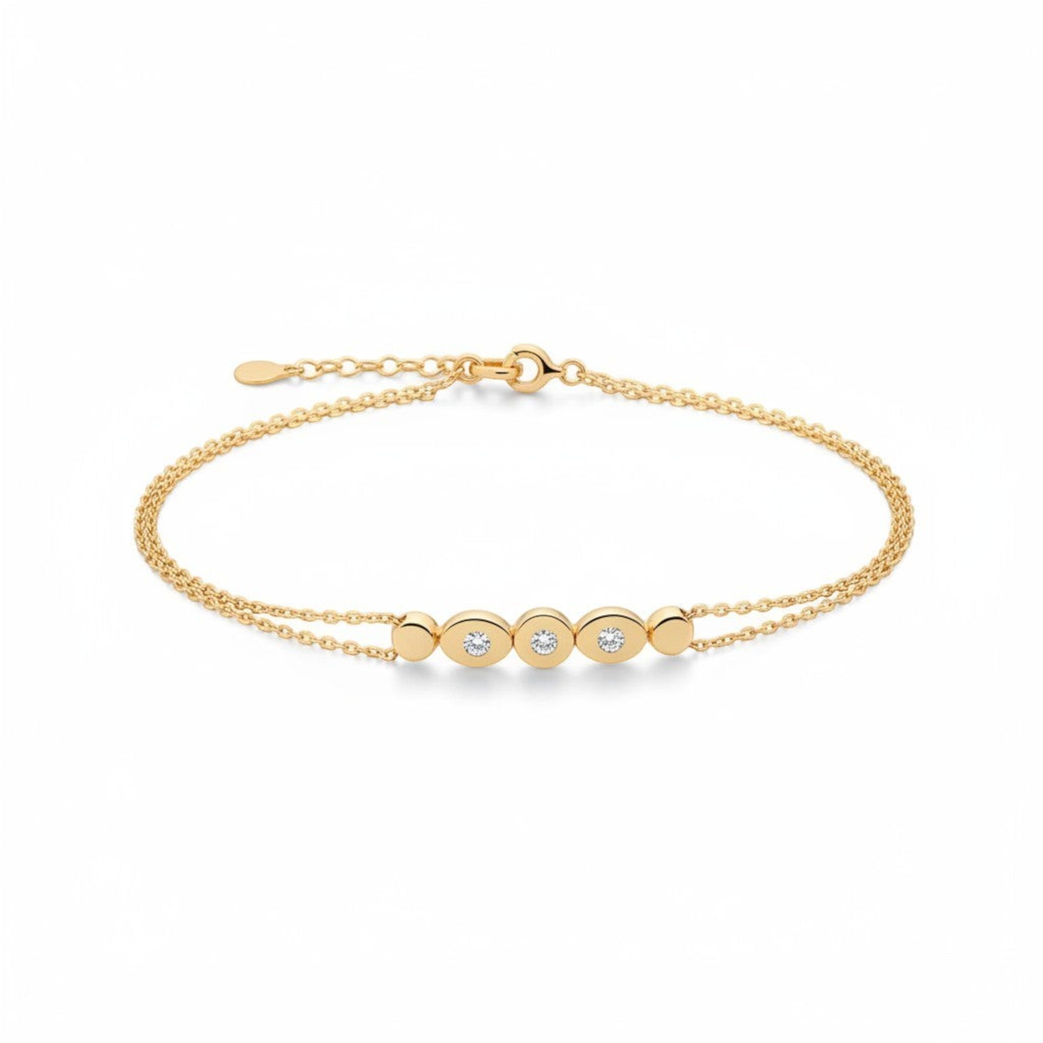 Tania Claire Australia gold bracelet with double chain and three sparkling stones set in oval gold bezels.