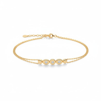 Tania Claire Australia gold bracelet with double chain and three sparkling stones set in oval gold bezels.