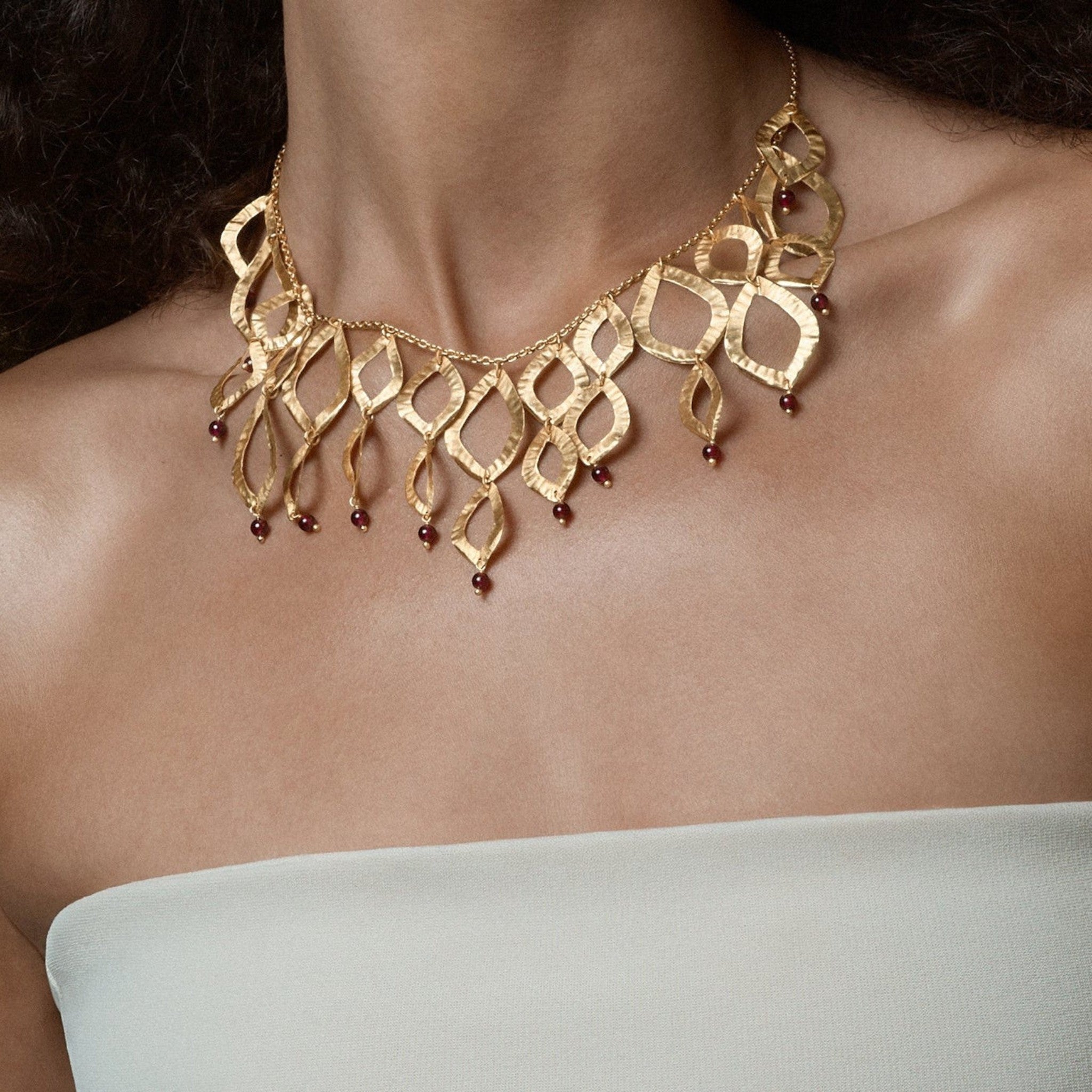 Tania Claire Australia gold brass necklace with flame design and garnet gemstones, 18 inches.