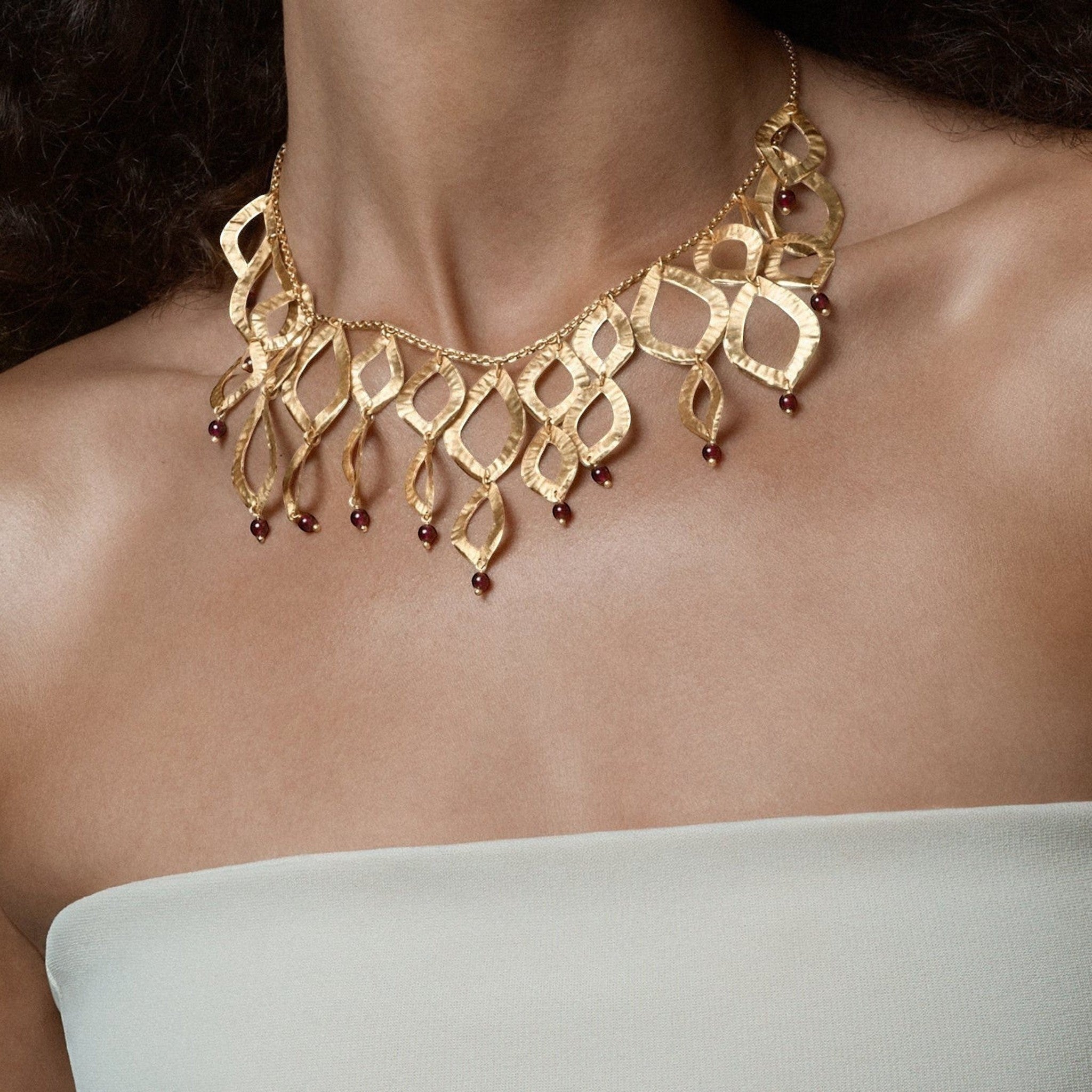 Tania Claire Australia gold brass necklace with flame design and garnet gemstones, 18 inches.