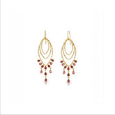 Tania Claire Australia Desert Dancer gold finish sterling silver earrings with garnet drops.