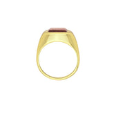 Tania Claire Australia gold signet ring with a rectangular faceted garnet gemstone. Modern sculptural design.
