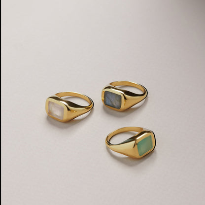 Tania Claire Australia gold signet ring with a rectangular rose quartz gemstone. Modern sculptural design.
