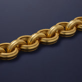 Tania Claire Australia Versailles gold link bracelet with textured and smooth interlocking rings, lobster clasp closure.