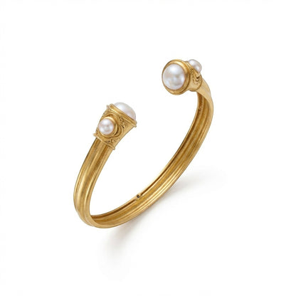 Tania Claire Australia gold cuff bracelet with freshwater pearl accents and open design.