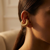 Tania Claire Australia gold-tone ear cuff with a chunky, ribbed architectural design worn on a model&